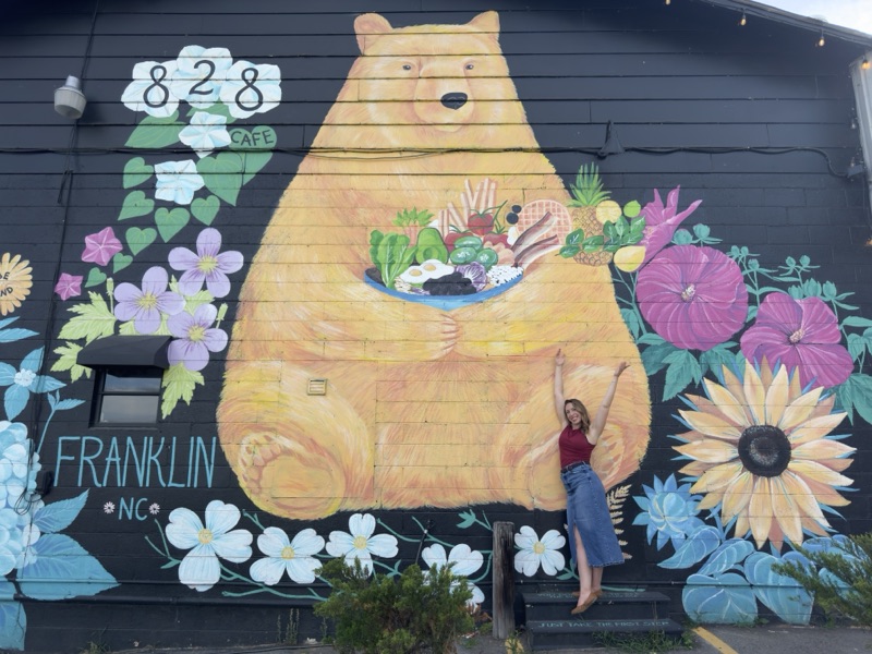 Brandi Rininger at the 828 Cafe bear mural in downtown Franklin, NC